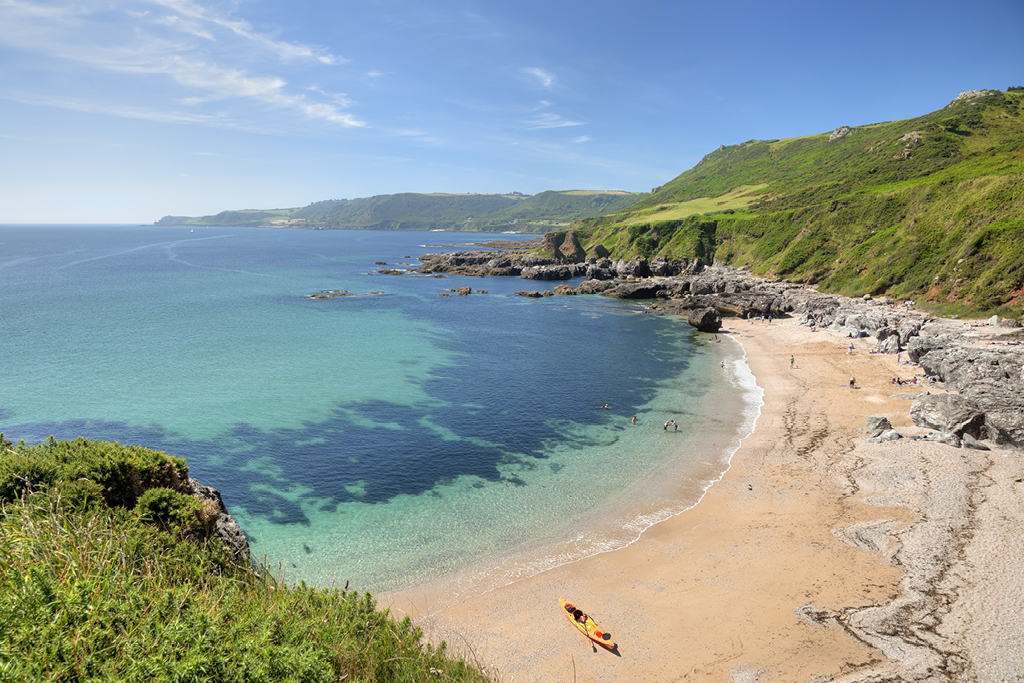 Sandy beaches, blue ocean and cliffs in Devon