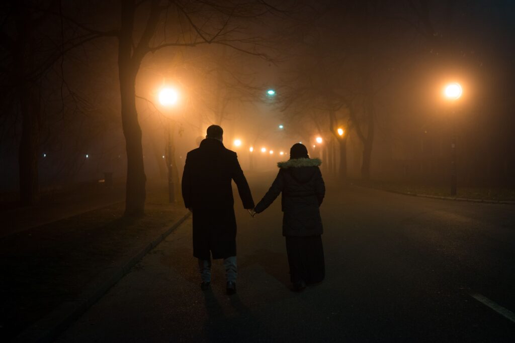 Couple Walking in dark night on Halloween